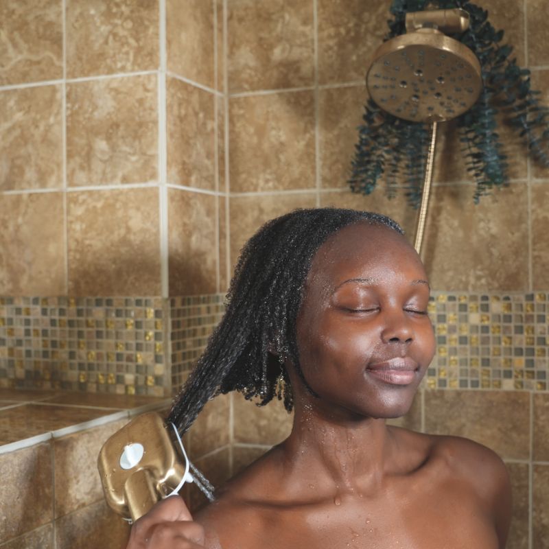 woman washing hair in the shower